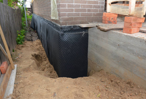 Happy homeowners after waterproofing job in Tremont City